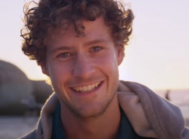 Man smiling at the camera, a still from a Lifeblood video.