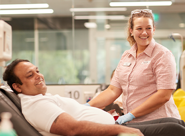 Nurse helping donor in a donor centre